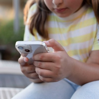 Young child holding a cellphone 
